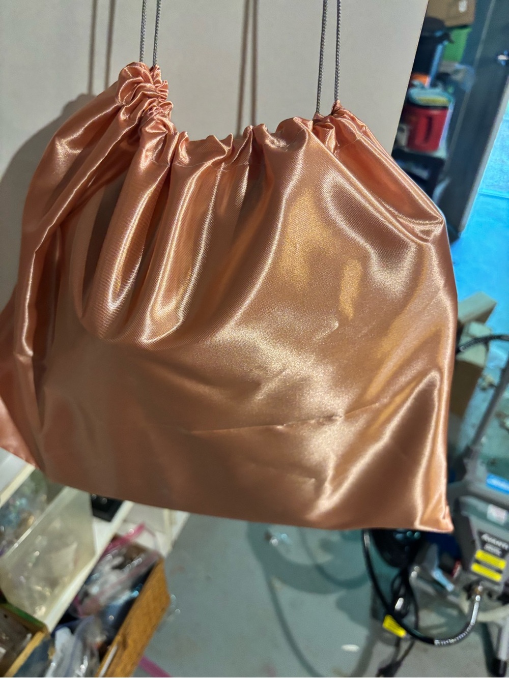 Satin Drawstring Shoulder Bag in Rose Gold